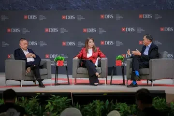 Intel CEO Tan Lip-Bu (right) and Broadcom CEO Hock Tan (left) in a panel discussion moderated by DBS CEO Tan Su Shan during the DBS Asia Future Forward Conference.