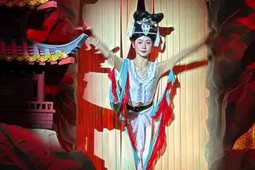 A dancer dressed as a flying celestial figure at Xuyan, an immersive dining venue at Raffles City The Bund in Shanghai, operated by CapitaLand.