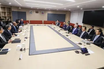 Senior Minister K Shanmugam (left, centre) at a meeting with the senior leadership of Singaporean companies allegedly linked to haze-related activities.