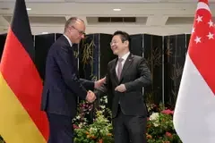 Singapore PM Lawrence Wong (right) and German Chancellor Friedrich Merz at a joint press conference at the Parliament House on Oct 27.