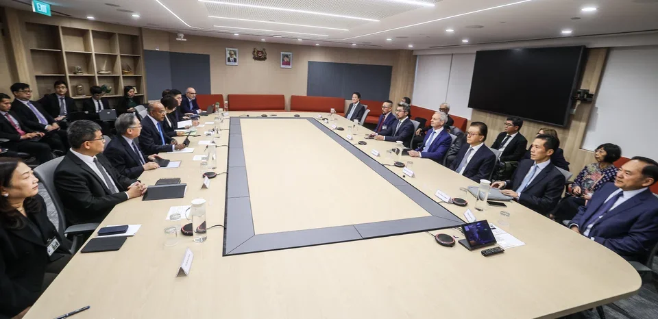 Senior Minister K Shanmugam (left, centre) at a meeting with the senior leadership of Singaporean companies allegedly linked to haze-related activities.