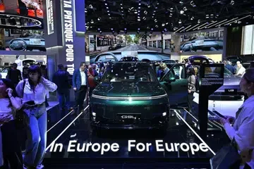 An "In Europe For Europe" sign beside an XPeng EV at the Paris Motor Show in Paris, France, on Oct 13.